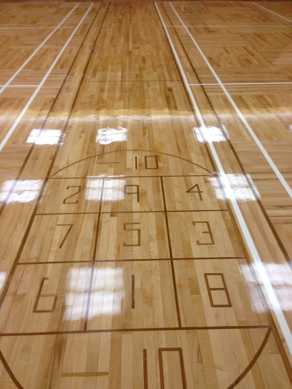 Finished hardwood flooring in a commercial hall