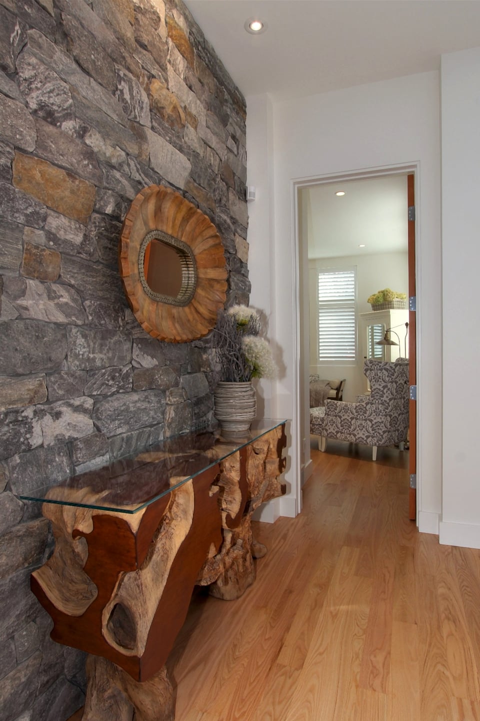 Refinished hardwood flooring running through an open-plan living area