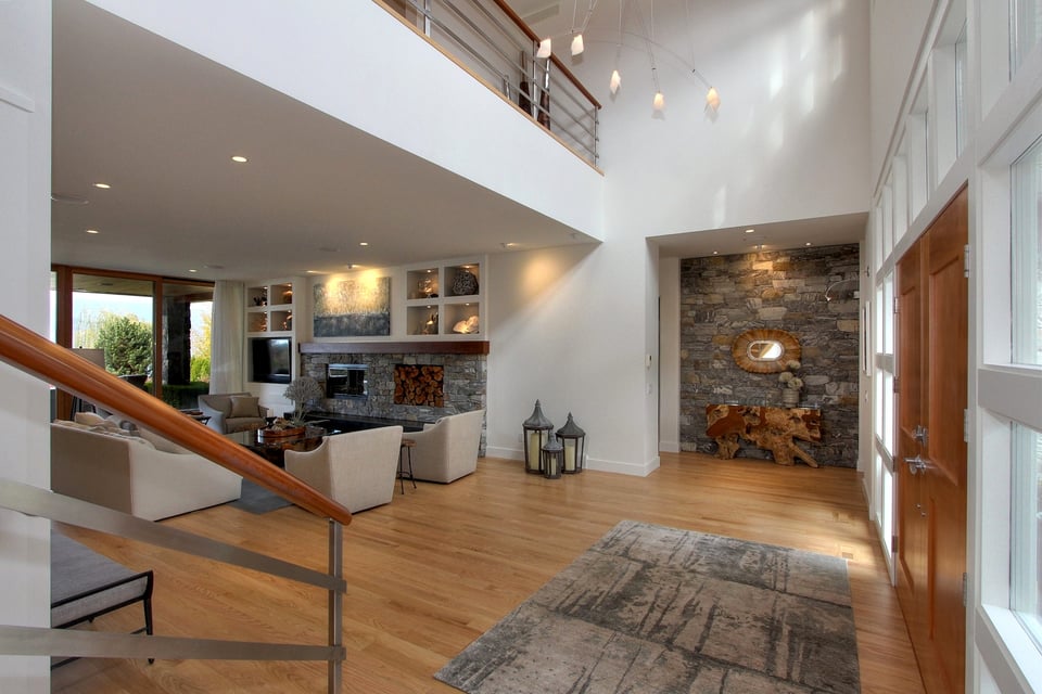 Hardwood flooring installed through a bright residential interior