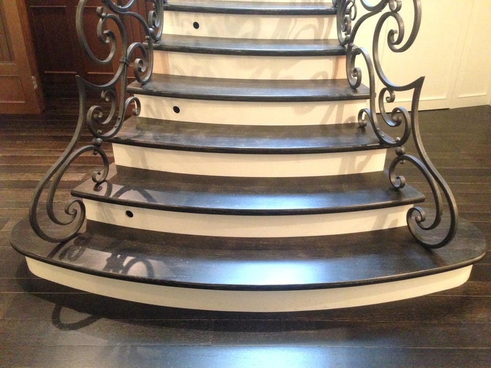 Hardwood stair treads and risers finished to match the surrounding floor